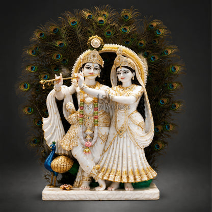 30 Inch Handcrafted Vietnam White Marble Radha Krishna Statue – Standing Pair Idol with Gold Ornamentation and Peacock Feather Backdrop