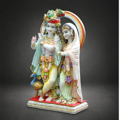 Radha Krishna Marble Statue with Peacock Feather Crown, Flute, Radha Krishna Idol with Peacock & Decorative Arch | Handcrafted Marble Murti